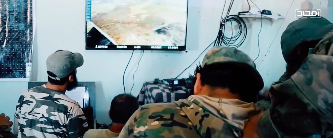 n HTS command and control center with a live drone feed on a TV monitor. From an August 2020 Amjad video.