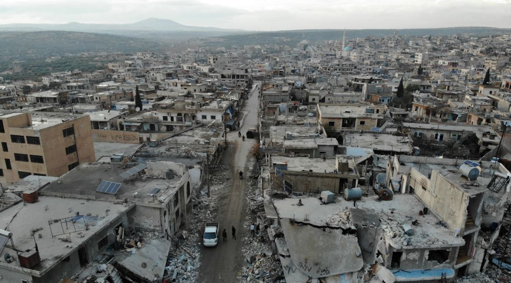 An aerial view taken on December 8, 2019 shows the damage caused by reported Syrian regime and Russian air strikes the previous day in the town of Al-Bara in the south of Syria's Idlib province, that killed at least four civilans, including a child and wounding several others. 