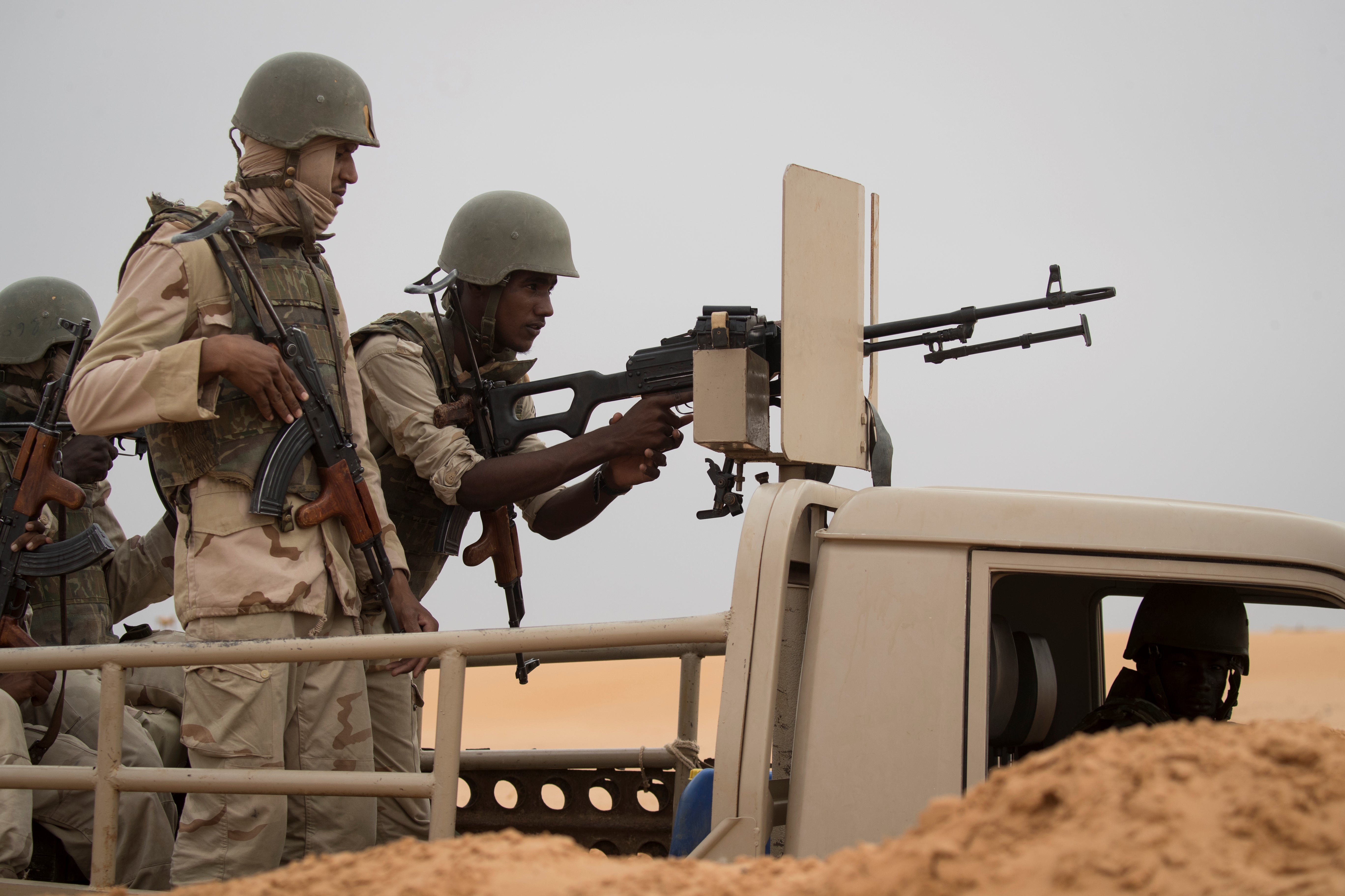 Photo above: Mauritanian soldiers stand guard at a G5 Sahel task force command post, on Nov. 22, 2018, in the southeast of Mauritania near the border with Mali. Photo by THOMAS SAMSON/AFP via Getty Images.