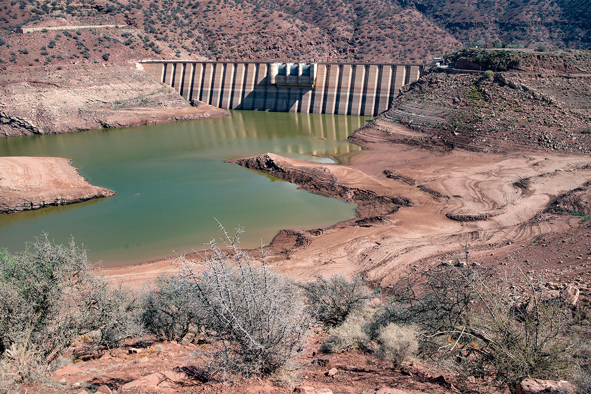 Photo above: The Abdelmoumen dam on Oct. 23, 2020. The Moroccan authorities have diverted water from the dams that irrigated farms to residential areas, to guarantee a supply to nearly a million people, as drought bites increasingly hard. Photo by FADEL SENNA/AFP via Getty Images. 