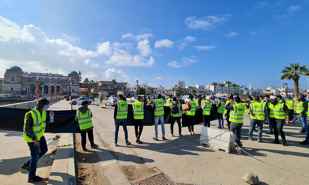 Libyan youth take part in a demonstration outside the central bank in the capital Tripoli on Dec. 23, 2020, demanding reforms to the banking system and central bank. Photo by AFP via Getty Images.