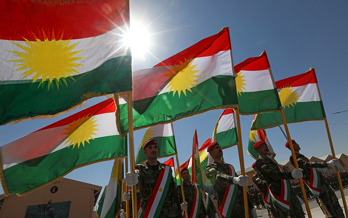 Iraqi-Kurdish Peshmerga officers take part in a graduation ceremony in Arbil, the capital of Iraq's northern autonomous Kurdish region, on June 21, 2021. (Photo by SAFIN HAMED / AFP) (Photo by SAFIN HAMED/AFP via Getty Images)