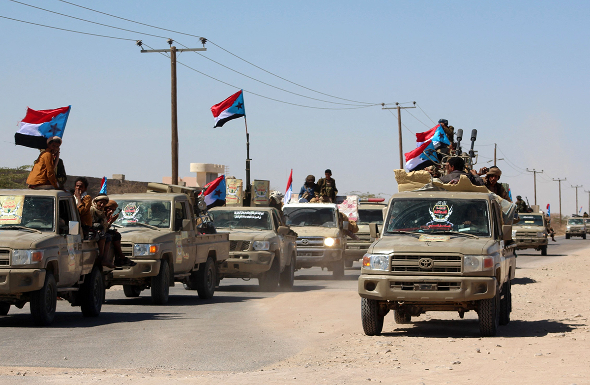 Yemeni pro-government fighters from the UAE-trained Giants Brigade gather on the outskirts of Ataq city, east of the Red Sea port of Aden, on their way to the frontline to face the Houthis on Jan. 28, 2022. Photo by SALEH AL-OBEIDI/AFP via Getty Images.