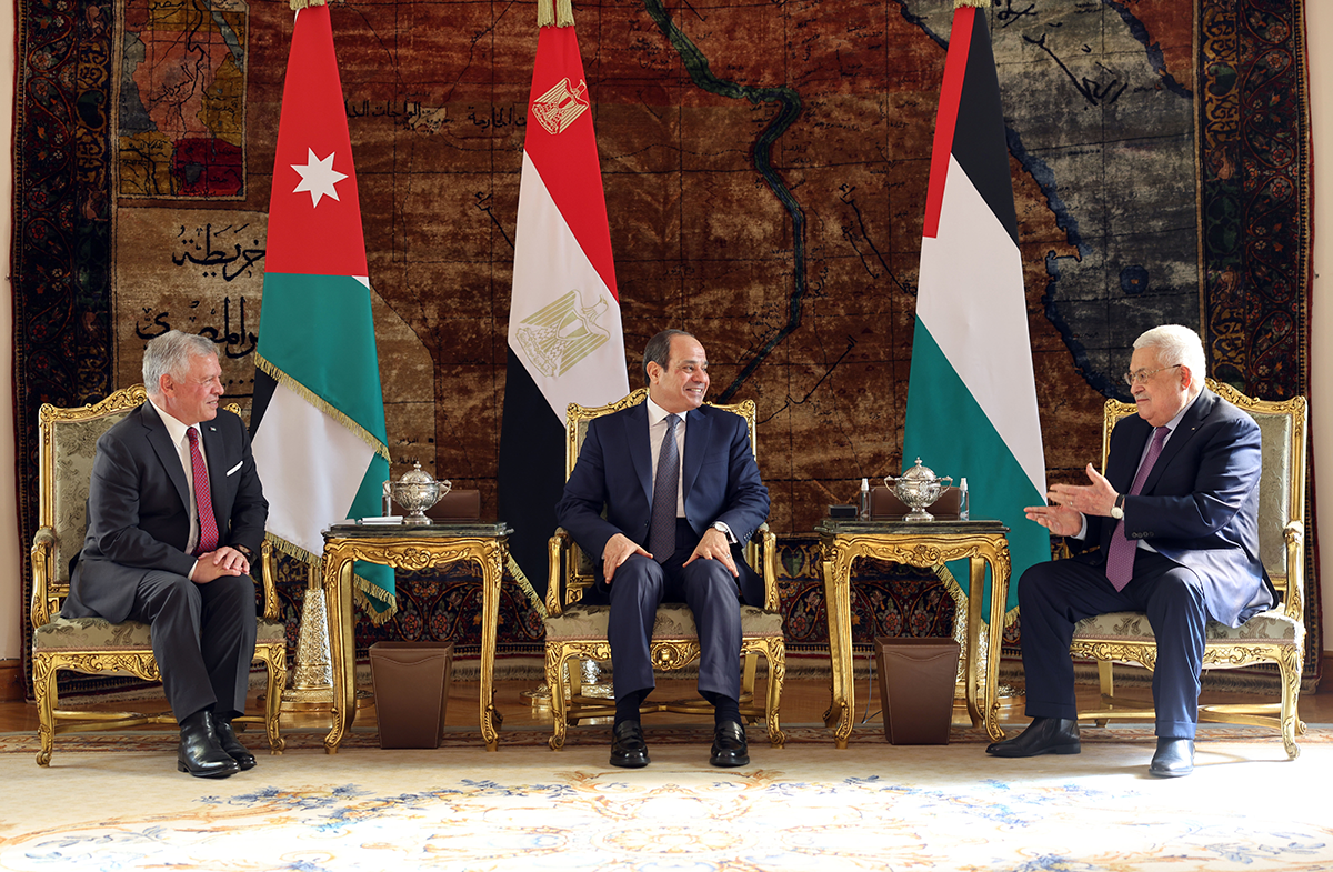 Egyptian President Abdel-Fattah el-Sisi (C), Palestinian President Mahmoud Abbas (R), and King Abdullah II of Jordan (L) meet for a summit in Cairo on Jan. 17, 2023. Photo by Palestinian Presidency/Handout/Anadolu Agency via Getty Images.