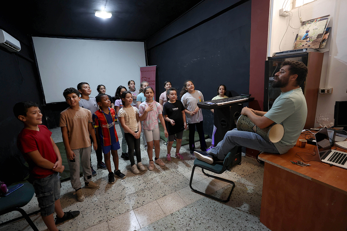Palestinian young people take part in a class at Freedom Theatre despite Israeli raids in Jenin, West Bank on June 19, 2023. The Freedom Theatre has become a cultural resistance for Palestinian youth as they find opportunity to participate in acting, musing and dancing classes since 2006 when it was founded. (Photo by Issam Rimawi/Anadolu Agency via Getty Images)