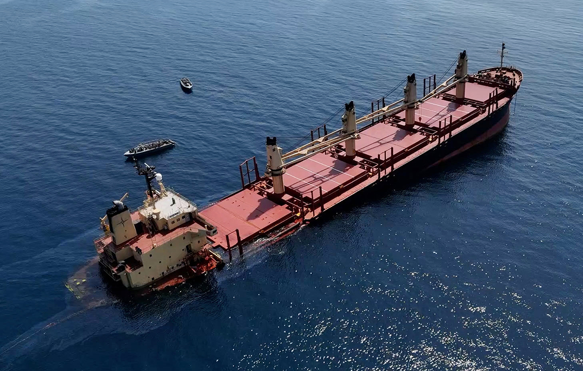 This handout photo from Yemen’s Al-Joumhouria TV shows the British-registered cargo ship Rubymar sinking after it was targeted by Houthi forces in international waters in the Red Sea on March 3, 2024. Photo by Al-Joumhouriah channel via Getty Images.