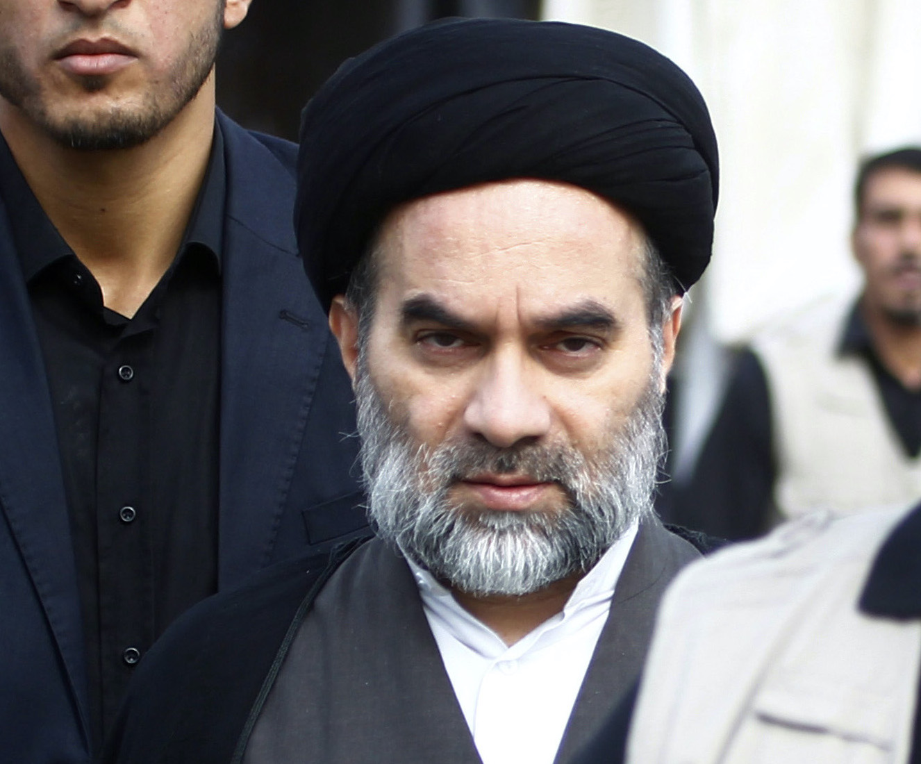 Mohammed Rida (C), son of Iraq’s top Shiite cleric Grand Ayatollah Ali Sistani, attends the funeral of Shiite fighters who were killed in the offensive to retake Mosul, in the holy Iraqi city of Najaf on November 2, 2016. Photo by HAIDAR HAMDANI/AFP via Getty Images.