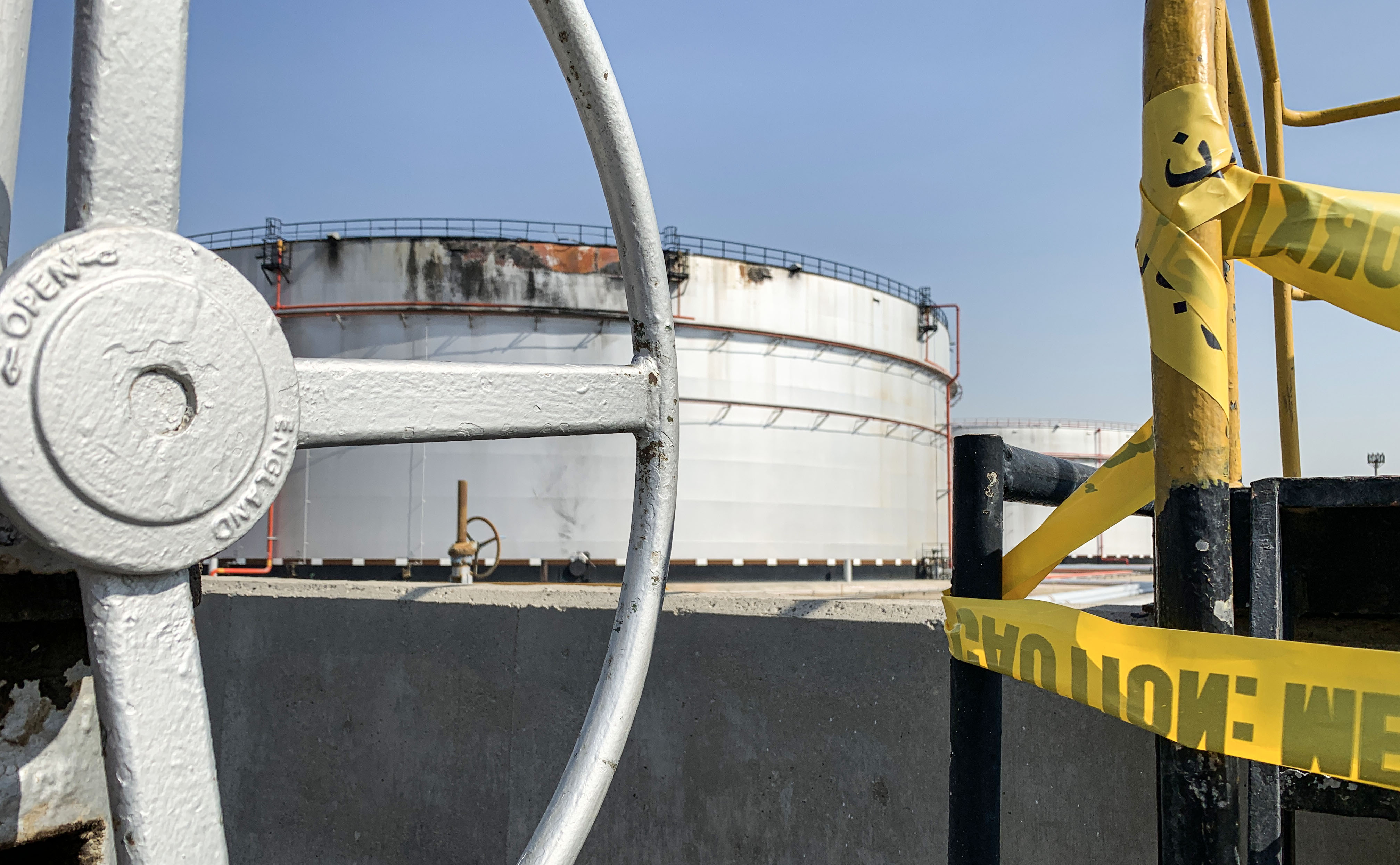 Photo above: A damaged silo at the Saudi Aramco oil facility in Jeddah, Saudi Arabia, allegedly attacked by a missile attack fired by Houthi forces on Nov. 23, 2020. Photo by FAYEZ NURELDINE/AFP via Getty Images.