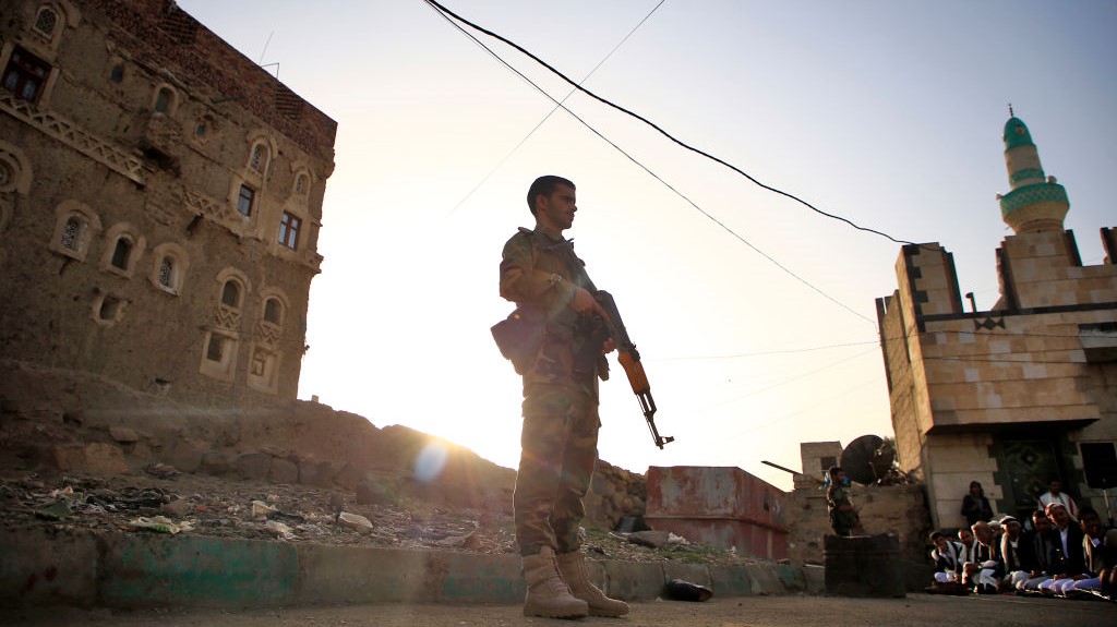 Yemeni security forces loyal to the Huthi-rebel government stands guard as Muslim worshippers perform Eid al-Fitr prayers at a square in the capital Sanaa on June 5, 2019, marking the end of the fasting month of Ramadan.