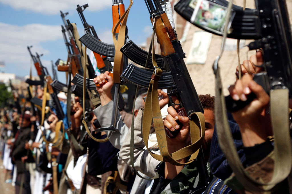 Houthi followers hold their guns during a tribal gathering against the continued war and blockade on October 03, 2019 in Sana'a, Yemen.