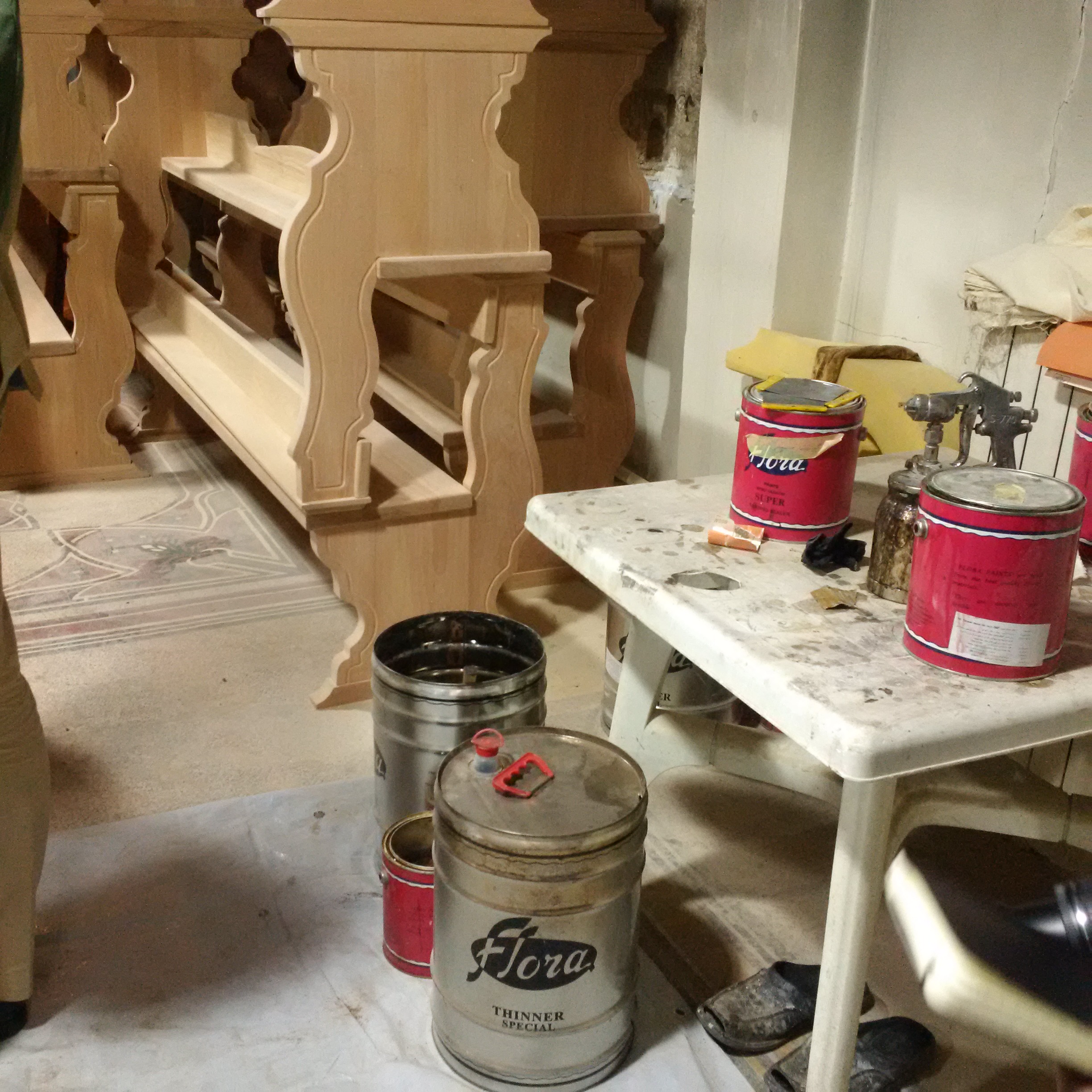 Newly made church pews in Homs about to be varnished.