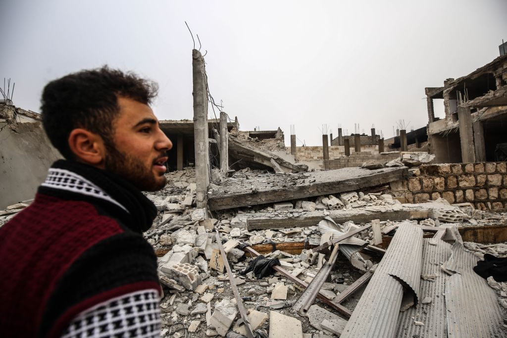 A man is seen around debris of buildings after warplanes belonging to Assad Regime hit Ma'ar Shoreen village, in Ma'arat al-Nu'man district of of Idlib, de-escalation zone, Syria on December 15, 2019.