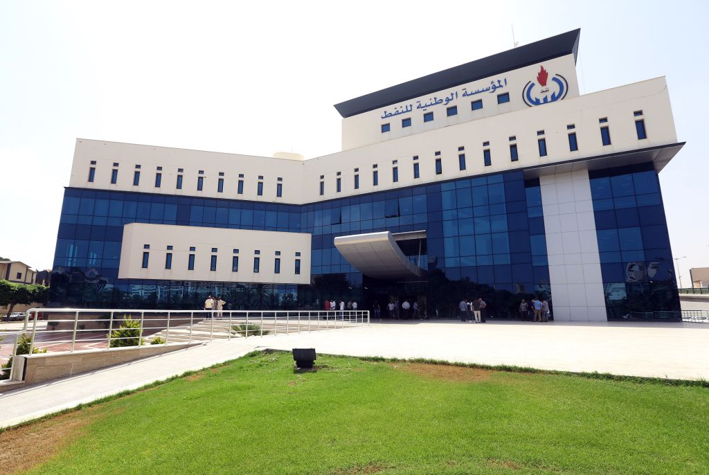 A picture taken on July 16, 2018, shows workers gathered at the building of the National Oil Corporation (NOC) of Libya, in the capital Tripoli on July 16, 2018. - Four workers were kidnapped on July 14 from an oil field in southern Libya, with two of them later released, Libya's National Oil Corporation said. 