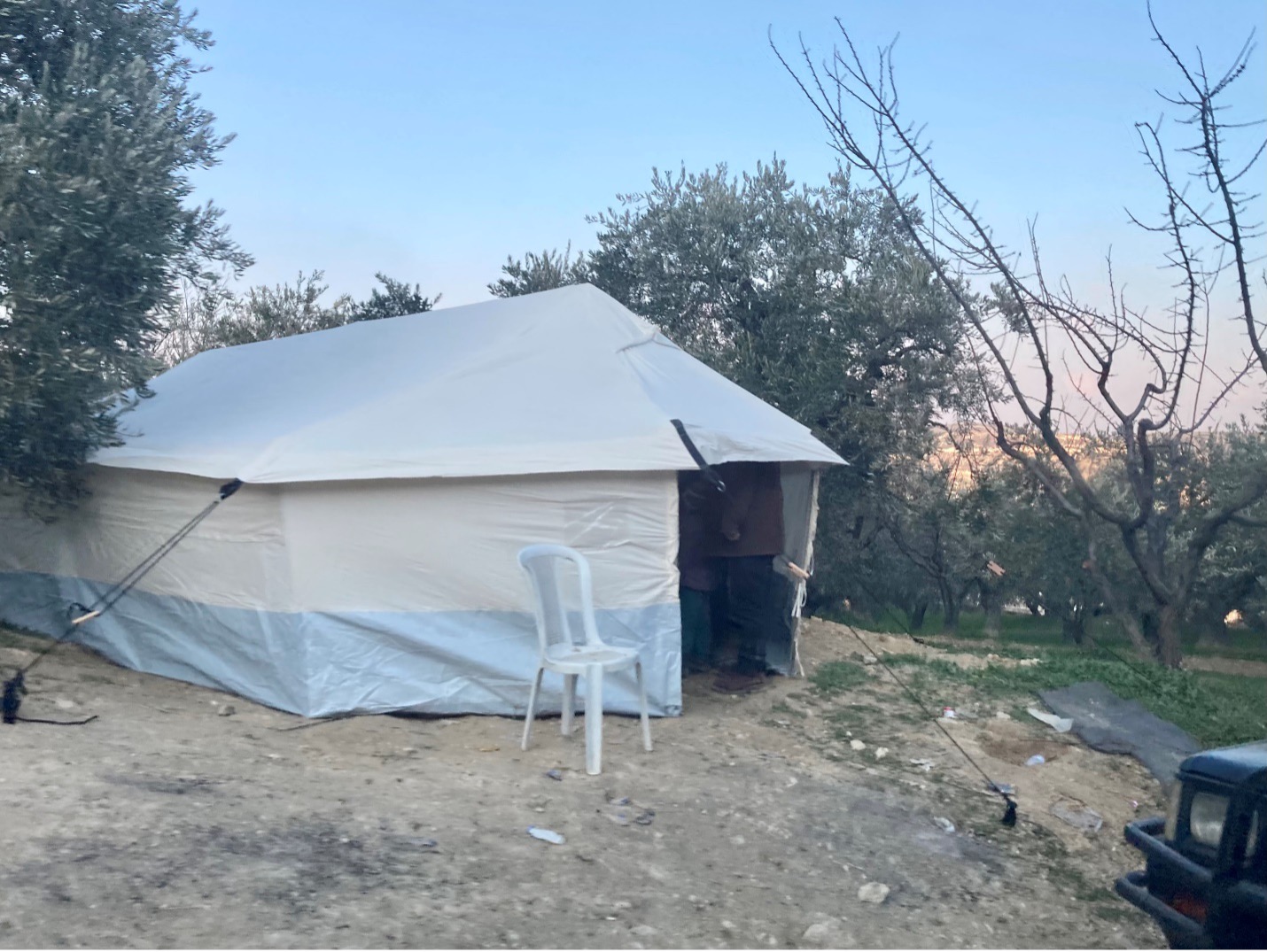 In small villages like Maland tents dot the hillsides as many of the displaced families simply set up in the space around their collapsed houses.