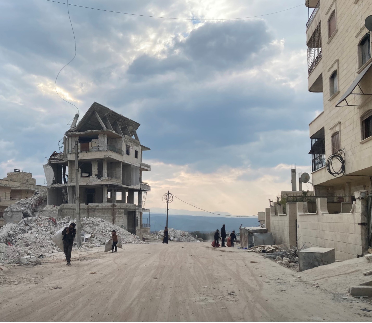 Many of the buildings in Salqin remain standing, but are unsafe to live in. Such buildings will need to be torn down before rebuilding can begin. Still, locals scavenge the ruins for useful items.