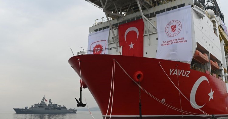 A picture taken at the port of Dilovasi, outside Istanbul, on June 20, 2019 shows the drilling ship 'Yavuz' scheduled to search for oil and gas off Cyprus, next to a warship. (Photo by BULENT KILIC/AFP via Getty Images)