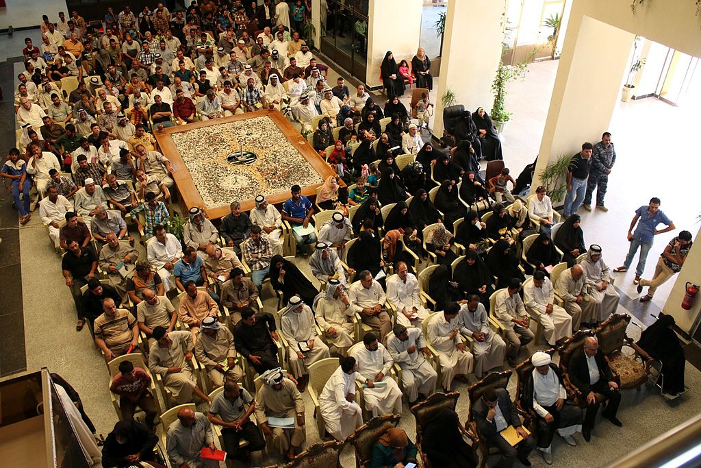 Iraqis who have fled the violence in Mosul attend a meeting with the provincial council of the southern port city of Basra, on July 28, 2014