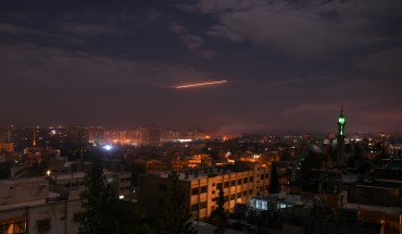 Syrian air defense batteries responding to Israeli missiles targeting Damascus