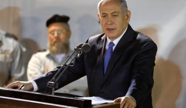 Prime Minister Benjamin Netanyahu (R) attends the funeral of Sergeant First Class Zachary Baumel at the Mount Herzl military cemetery in Jerusalem on April 4 2019.