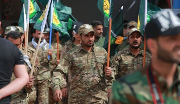 Members of the the predominantly Shia Muslim PMF take part in a PMF conference to honor Iranian fighters who died fighting ISIS