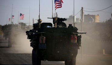 TOPSHOT - A convoy of US forces armoured vehicles drives near the village of Yalanli, on the western outskirts of the northern Syrian city of Manbij, on March 5, 2017. / AFP PHOTO / DELIL SOULEIMAN (Photo credit should read DELIL SOULEIMAN/AFP/Getty Images)