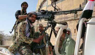 Supporters of al-Qaeda tote their rifles in the back of a pick-up truck in the town of Rada, 130 kilometres (85 miles) southeast of the capital Sanaa, on January 23, 2012.