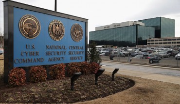 he seals of the U.S. Cyber Command, the National Secrity Agency and the Central Security Service greet employees and visitors at the campus the three organizations share March 13, 2015 in Fort Meade, Maryland.