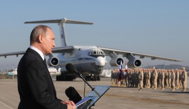 LATAKIA, SYRIA DECEMBER 11, 2017: Russia's President Vladimir Putin addresses Russian forces at the Russian Hmeimim air base. Putin has ordered Russian troops to start pulling out of Syria. Mikhail Klimentyev/Russian Presidential Press and Information Office/TASS (Photo by Mikhail Klimentyev\TASS via Getty Images)