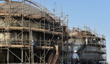 Employees of Aramco oil company work in Saudi Arabia's Abqaiq oil processing plant on September 20, 2019