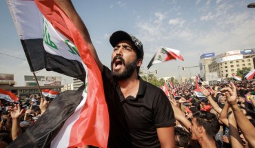 Protesters shout slogans during an anti-government demonstration against the provision of jobs and the alleged government corruption, in Tahrir Square in central Baghdad. 