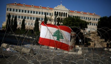 A Lebanese national flag fixed on barbed wire protecting the government headquarters, known as the Grand Serail, in central Beirut.