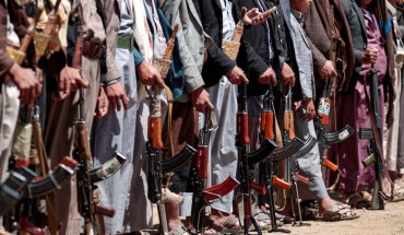 Yemeni men stand with Kalashikov assault rifles during a tribal meeting in the Huthi rebel-held capital Sanaa on September 21, 2019, as tribesmen donate rations and funds to fighters loyal to the Houthis along the fronts. 