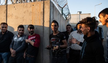 Syrian refugees wait in queue to enter to the Kahramanmaras refugee camp after coming from shopping on September 19, 2019 in Kahramanmaras, Turkey.