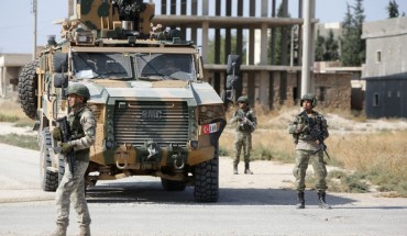 Turkish soldiers patrol the northern Syrian Kurdish town of Tal Abyad, on the border between Syria and Turkey, on October 23, 2019