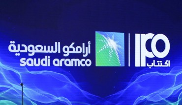 A picture taken on November 3, 2019 shows a sign of Saudi Aramco's initial public offering (IPO) during a press conference by the state company in the eastern Saudi Arabian region of Dhahran.