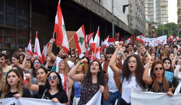 BEIRUT, LEBANON - NOVEMBER 03: People gather at Bechara El-Khoury Avenue to call protesters for them to continue the demonstrations until a new government formed as they march from Martyrs Square and Riyadh al-Solh Square in Beirut, Lebanon on November 03, 2019. (Photo by Mahmut Geldi/Anadolu Agency via Getty Images)