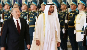 Abu Dhabi Crown Prince Mohammed bin Zayed al-Nahayan (R) reviews an honour guard with Kazakhstan's President Nursultan Nazarbayev during a welcoming ceremony in Astana on July 4, 2018.