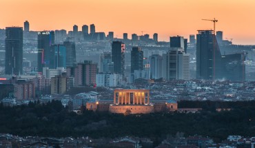 The sunset casts an orange sky over the new urban skyline of Turkey's capital city, Ankara, which is centered around the Anitkabir, the memorial tomb of the country's founding father Mustafa Kemal Ataturk.