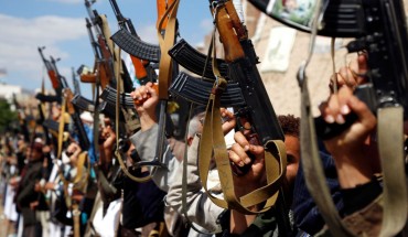 Houthi followers hold their guns during a tribal gathering against the continued war and blockade on October 03, 2019 in Sana'a, Yemen.