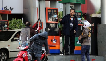 Iranians fill their vehicles at a petrol station in Tehran, on November 15, 2019.