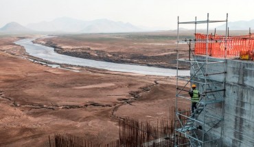 A worker goes down a construction ladder at the Grand Ethiopian Renaissance Dam (GERD), near Guba in Ethiopia, on December 26, 2019. 