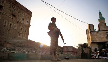 Yemeni security forces loyal to the Huthi-rebel government stands guard as Muslim worshippers perform Eid al-Fitr prayers at a square in the capital Sanaa on June 5, 2019, marking the end of the fasting month of Ramadan.