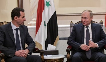 Syria's President Bashar al-Assad (L) and Russia's President Vladimir Putin during a meeting in the Cathedral of Our Lady of the Dormition. 