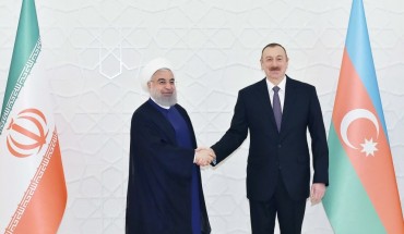 Iranian President Hassan Rouhani (L) meets President of Azerbaijan Ilham Aliyev (R) during his official visit in Baku, Azerbaijan on March 28, 2018.