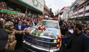 Mourners surround a car carrying the coffins of Iranian military commander Qasem Soleimani and Iraqi paramilitary chief Abu Mahdi al-Muhandis, killed in a US air strike, during their funeral procession in Kadhimiya, a Shiite pilgrimage district of Baghdad, on January 4, 2020. 