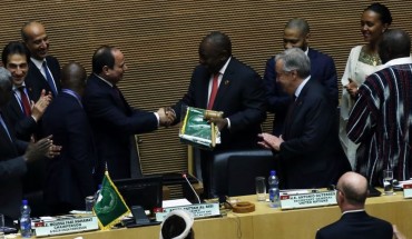 South African President Cyril Ramaphosa (5th R) assumes gavel for a year-long African Union (AU) presidency from the outgoing Abdel-Fattah El-Sisi (5th L), the Egyptian president, during the 33rd African Union Heads of State Summit in Addis Ababa, Ethiopia on February 09, 2020. 