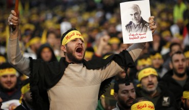 Supporters shout slogans during a rally for Qassem Soleimani in southern suburbs of Beirut, Lebanon, on Jan. 5, 2020. Hezbollah leader Sayyed Hassan Nasrallah urged on Sunday its fighters to attack U.S. soldiers in the region in retaliation for the assassination of Iranian top commander Qassem Soleimani by the United States. (Photo by Bilal Jawich/Xinhua via Getty) (Xinhua/ via Getty Images)