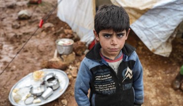  Syrian child poses at a camp hosting Syrian families, who have been forced to displace due to the attacks carried out by Assad regime and Russia, in Idlib, Syria on January 10, 2020. 