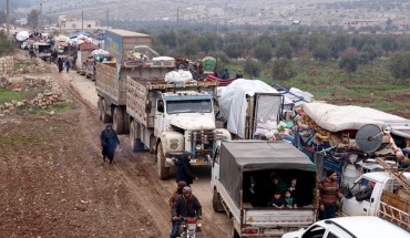 Syrian families, who have been forced to displace due to the ongoing attacks carried out by Assad regime and Russia, are seen on their way to safer zones with their belongings, at Atme camps in Idlib, Syria on January 19, 2020. 