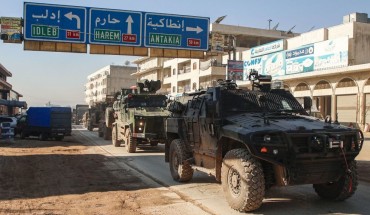 A Turkish military convoy of tanks and armoured vehicles passes through the Syrian town of Dana, east of the Turkish-Syrian border in the northwestern Syrian Idlib province, on February 2, 2020.